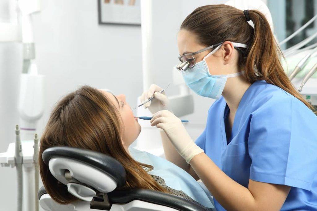 Dentist Working On A Patient